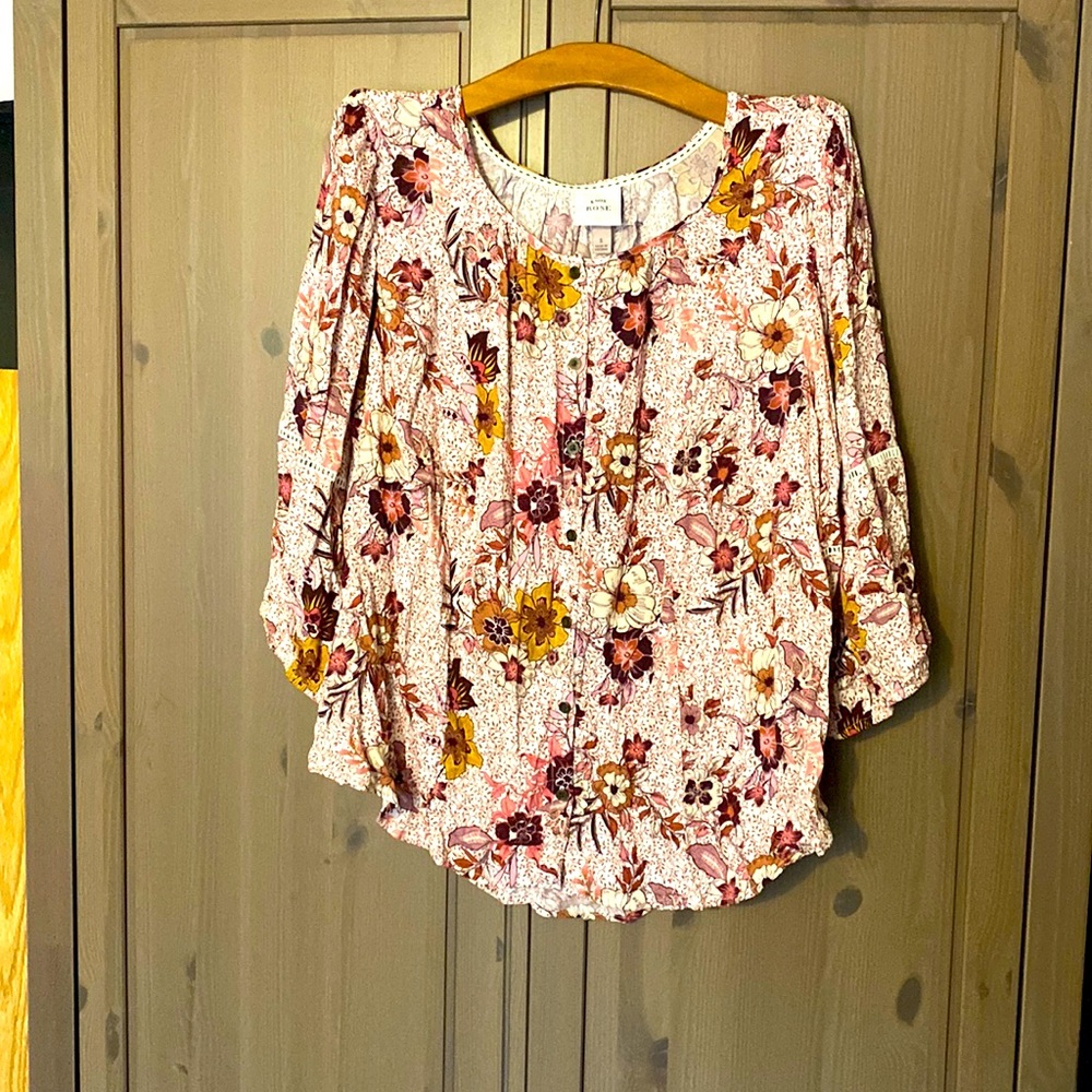 Button up blouse with puffy sleeves embellished with lace cut out on sleeves